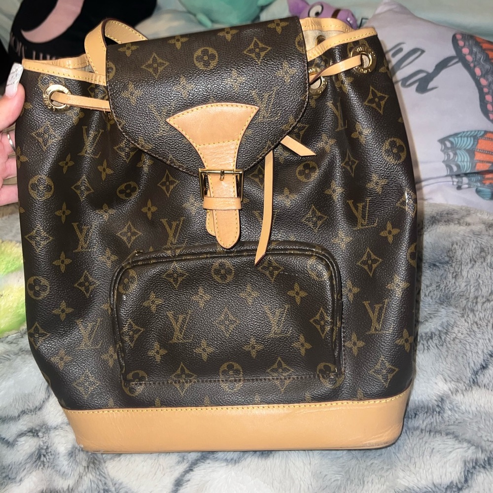 Lv backpack with broken strap.
